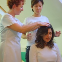 A student learning the techniques of Indian Head Massage